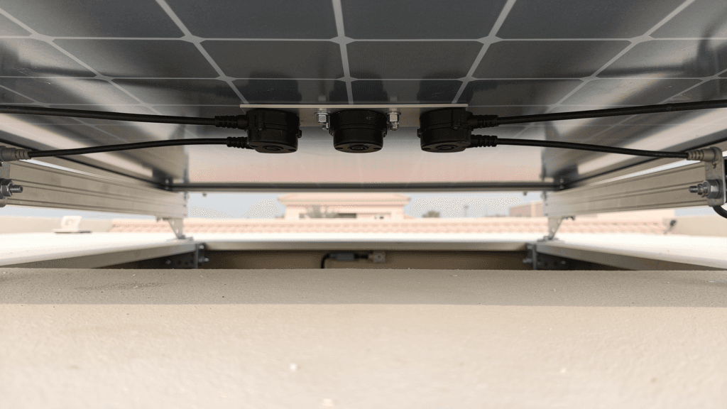 AI-generated illustration of the rear cell face and junction components of a bifacial solar module above a light-coloured roof