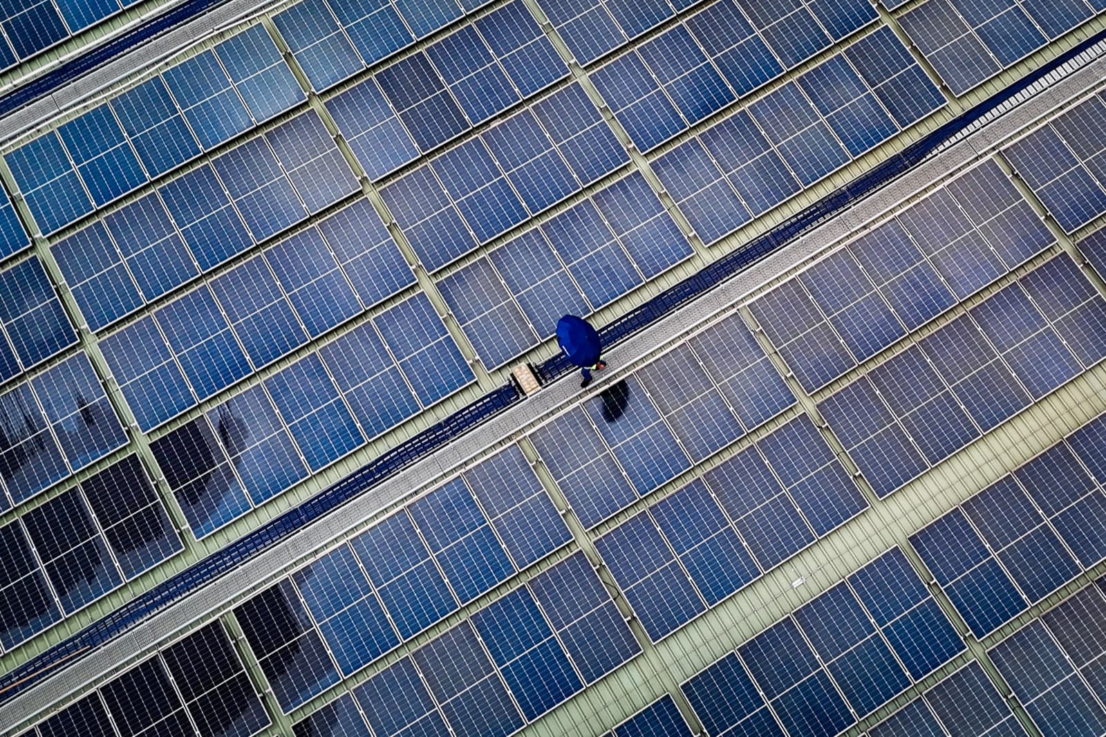 Solar panel array on an industrial rooftop, photographed in Bangladesh as an illustrative example